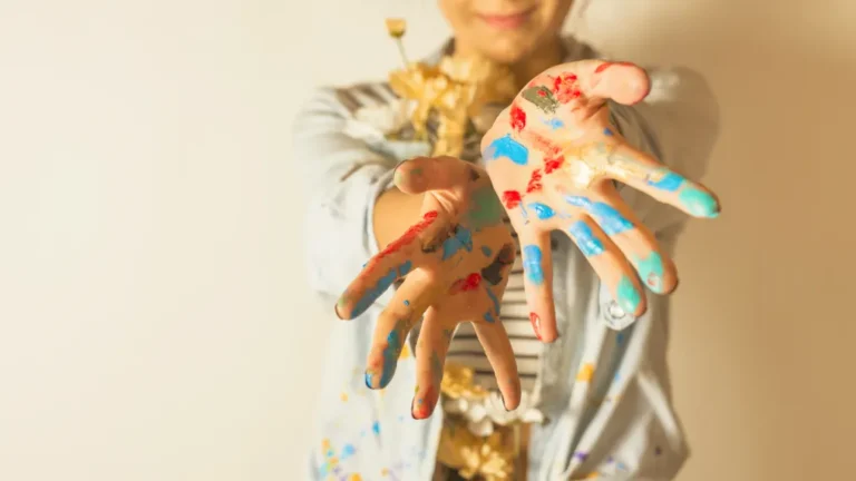 portrait-female-artist-with-paint-hands
